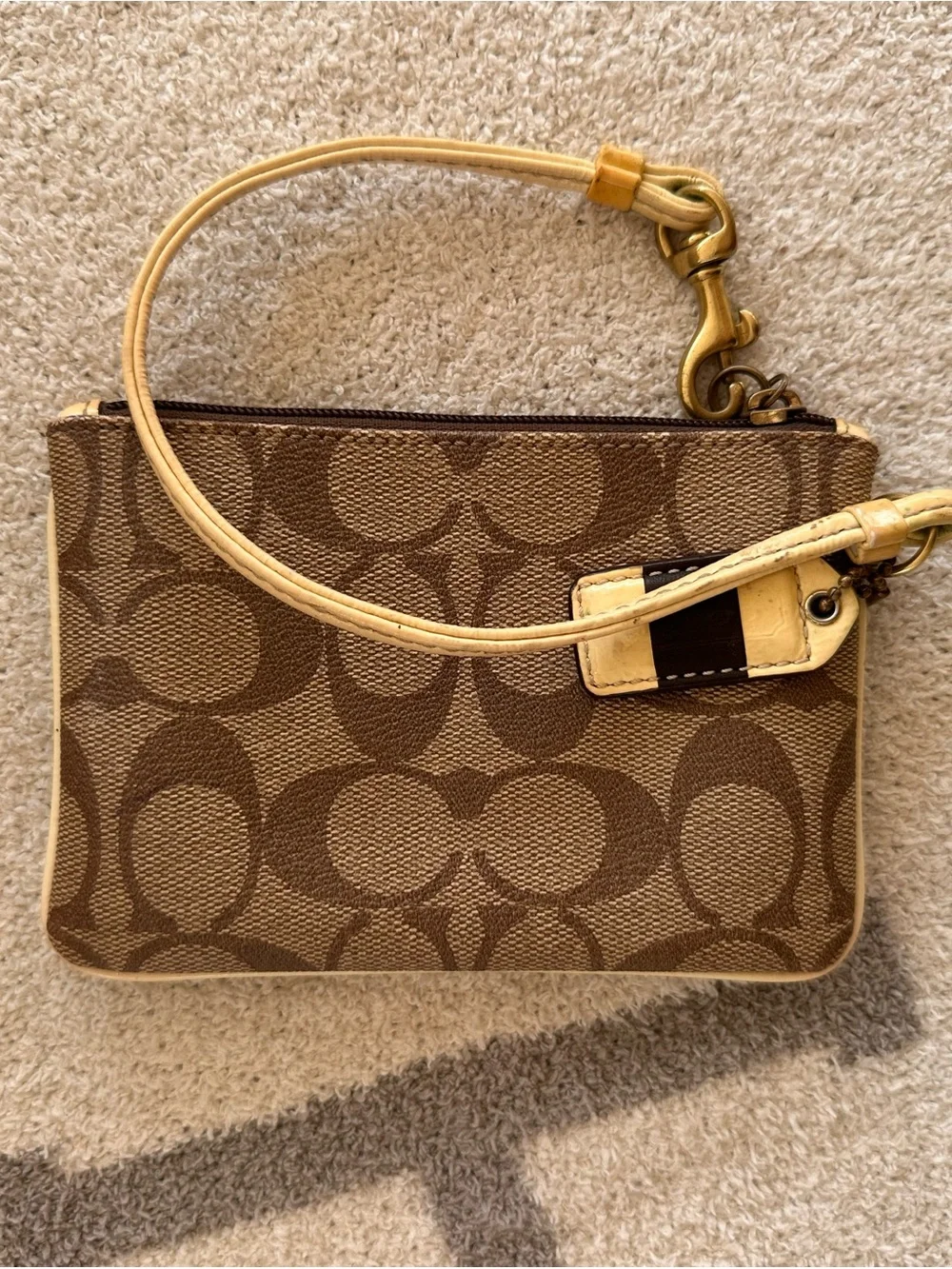 Coach Brown and Cream Signature Zip Wristlet with Gold Hardware